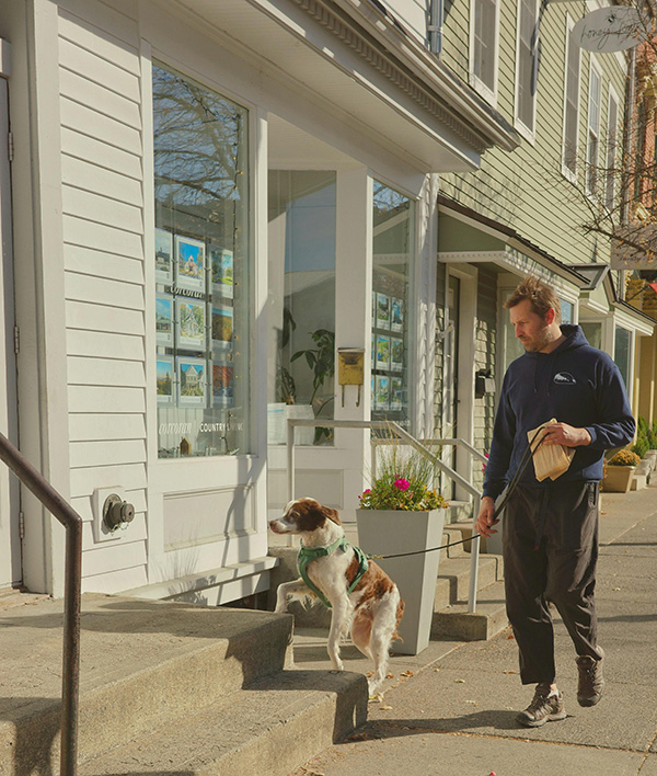 Man walking his curious dog