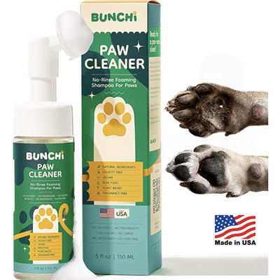 Bunchi Paw Cleaner product display featuring a 5 fl oz no-rinse foaming shampoo for dog paws. The packaging highlights natural ingredients, cruelty-free, hypoallergenic, vegan, and fragrance-free benefits. Before-and-after photos of a dog's dirty and clean paw show the product’s effectiveness, and a small "Made in USA" badge is included.