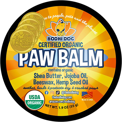 Bodhi Dog Paw Balm Round container of Bodhi Dog Certified Organic Paw Balm, featuring USDA Organic seal and containing shea butter, jojoba oil, beeswax, and hemp seed oil, designed to soothe and protect dry and cracked pet paws.